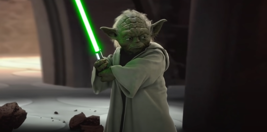 Star Wars movie screenshot, a character holding a glowing sword