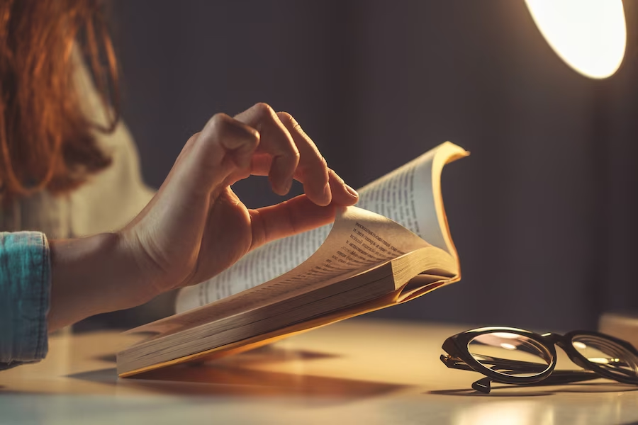 Hand turning a page of a book