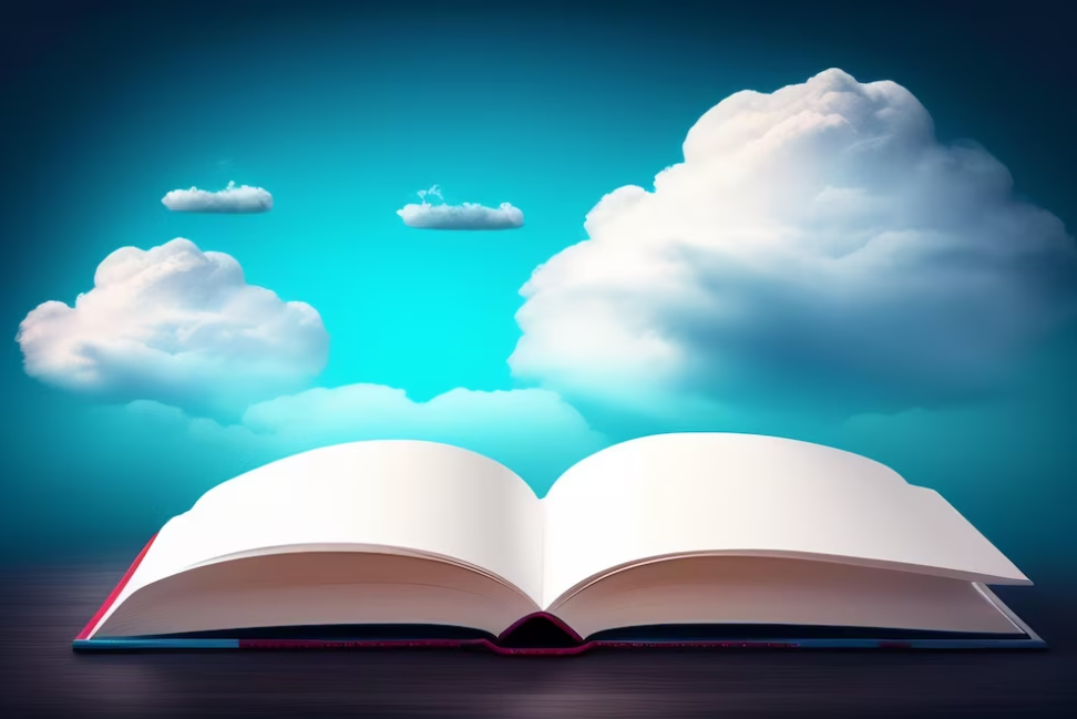 opened book on the table, clouds and blue sky behind